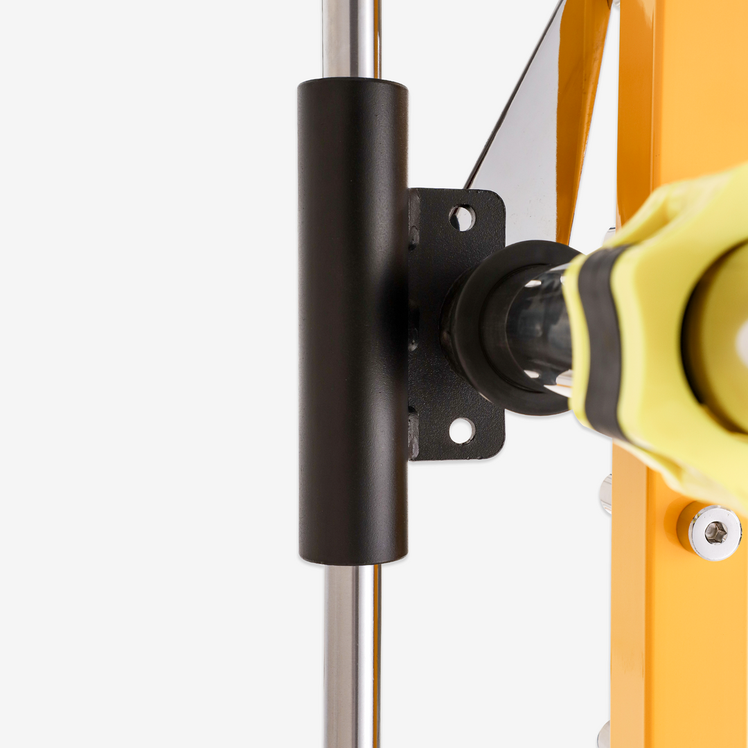 Close-up of a bicycle's suspension fork with a yellow and black shock absorber on a white background.