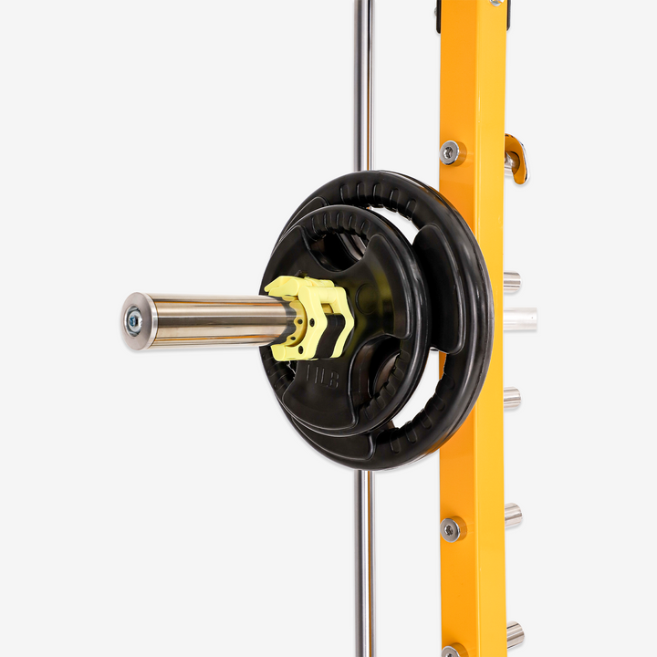Yellow weight rack with black weight plates on a white background
