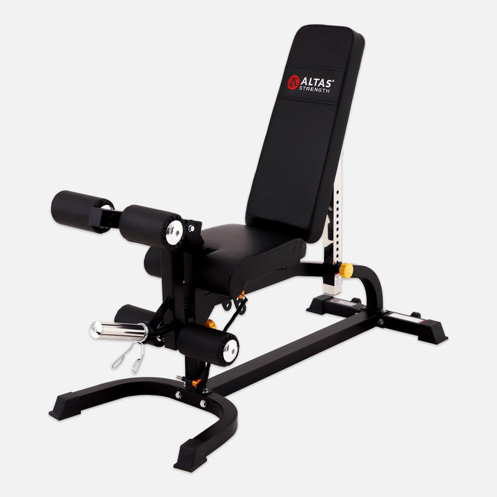 Black weight bench with adjustable components on a white background, featuring the Altas Strength logo.