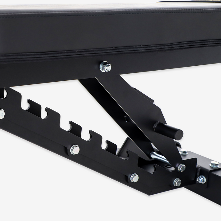 Close-up of a black metal bracket with screws on a white background