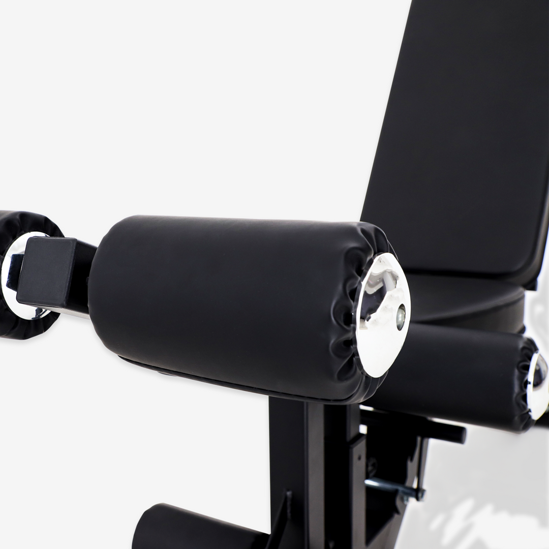 Close-up of a black weight bench with padding on a white background