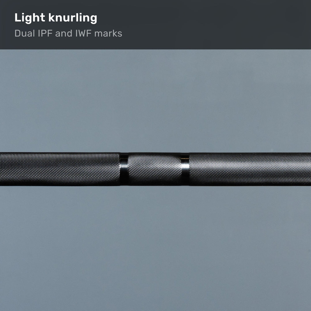 Close-up of the barbell knurling and grip marks
