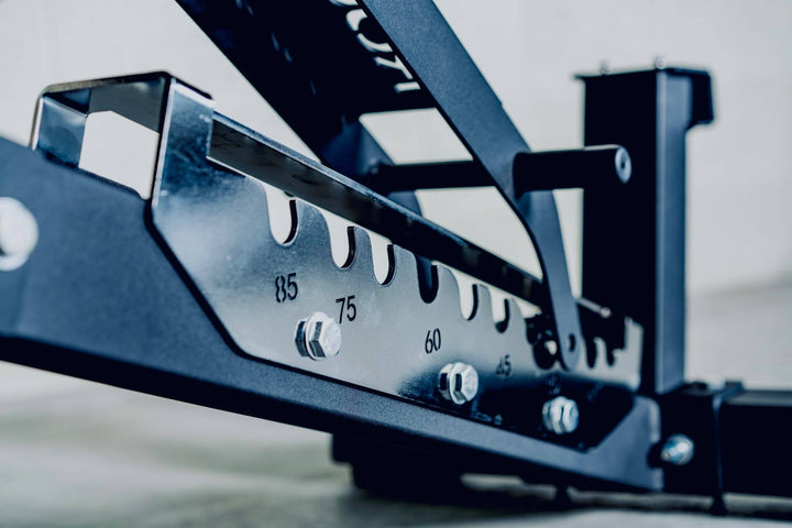 Close-up of adjustable bench steel frame showing weight increments, designed for heavy-duty workouts.