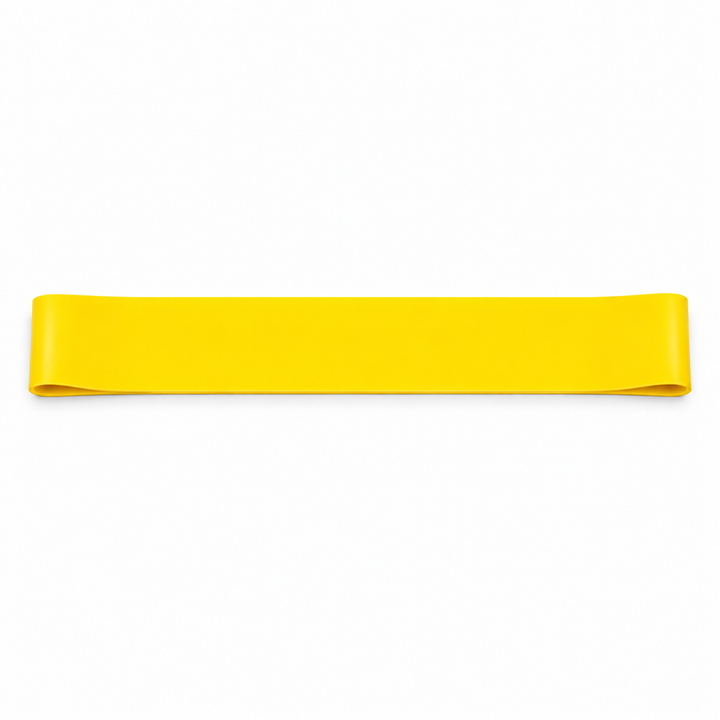 Yellow single mini loop resistance band on a white background